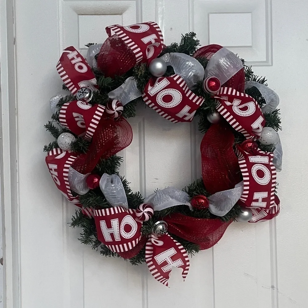 Handmade Christmas wreath, ribbon,bells, and ornaments. Silver, white and red